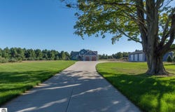 1776 E BELLINGER ROAD, CEDAR, MI 49621