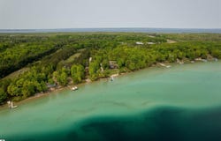 11767 WILD CHERRY LANE, KEWADIN, MI 49648