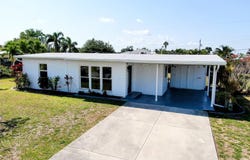 140 POINSETTIA CIRCLE NE, PORT CHARLOTTE, FL 33952