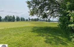# 8 MOONEY WAY, KEWADIN, MI 49648