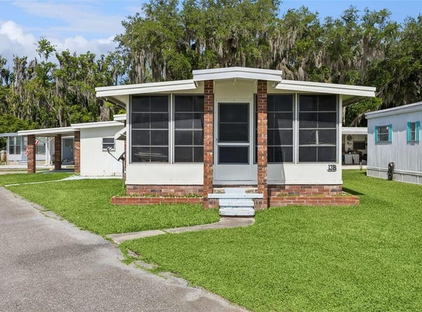 13 COCOS PLUMOSA DRIVE, EUSTIS, FL 32726