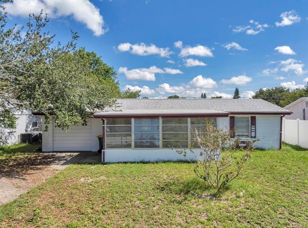 4911 BARTELT ROAD, HOLIDAY, FL 34690