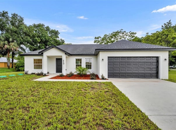 210 E BAXTER STREET, DE LEON SPRINGS, FL 32130