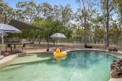 /international/au/7-porteus-road-withcott-qld-151012764/